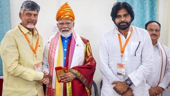 AP Exit Poll 2024 Live: Prime Minister Narendra Modi being greeted by TDP President N Chandrababu Naidu and Jana Sena Party president K Pawan Kalyan (PK) in Varanasi.(PTI)