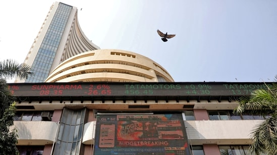 Stock market LIVE Updates: A bird flies past a screen displaying the Sensex results on the facade of the Bombay Stock Exchange (BSE) building in Mumbai