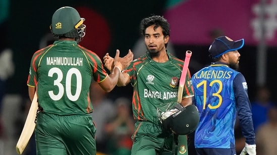 Bangladesh's Tanzim Hasan and teammate Mahmudullah, left, react following the men's T20 World Cup cricket match between Sri Lanka and Bangladesh at Grand Prairie Stadium, Grand Prairie, Texas, Friday, June 7(PTI)