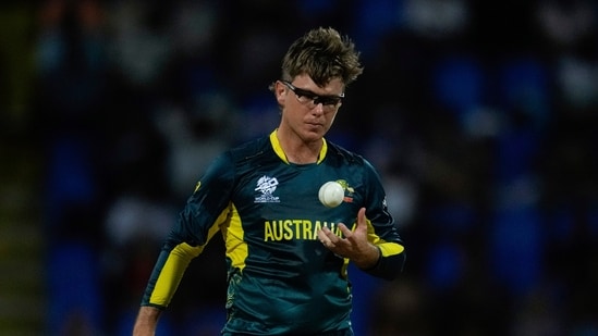 Australia's Adam Zampa tosses a ball while bowling against Namibia during an ICC Men's T20 World Cup cricket match at Sir Vivian Richards Stadium(PTI)