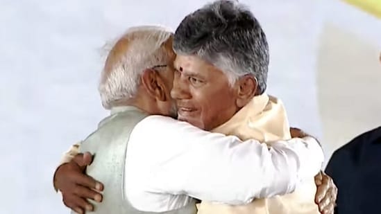 Prime Minister Narendra Modi greets Nara Chandrababu Naidu after he was sworn-in as the chief minister of Andhra Pradesh at a ceremony in Vijayawada, on Wednesday. (PTI)