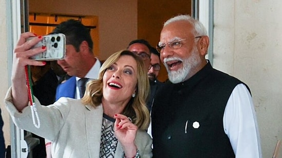 Prime Minister Narendra Modi poses for a selfie with Italian PM Giorgia Meloni on the sidelines of the G7 Outreach Summit, in Apulia on Saturday. (ANI)