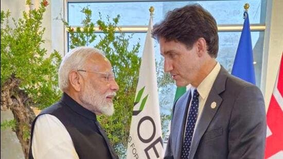 Prime Minister Narendra Modi with his Canadian counterpart Justin Trudeau on the sidelines of the G7 summit, in Apulia, Italy. (PTI)