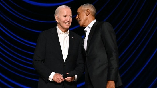 Former President, Barack Obama guides US President Joe Biden after he froze on stage during the L.A. Fundraiser at Peacock Theater, L.A., &nbsp;June 15, 2024. (Photo by Mandel NGAN / AFP)(AFP)