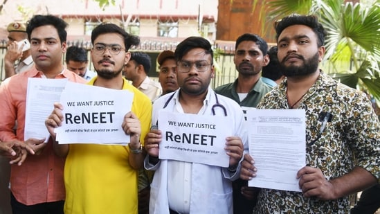 Students holding placards protest against the alleged irregularities in the NEET examination in New Delhi. (ANI file)