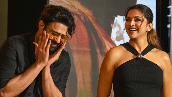 Actors Deepika Padukone (R) and Prabhas attend a promotional event of their upcoming Indian epic science fiction dystopian film �Kalki 2898 AD� in Mumbai on June 19, 2024. (Photo by Sujit JAISWAL / AFP)(AFP)