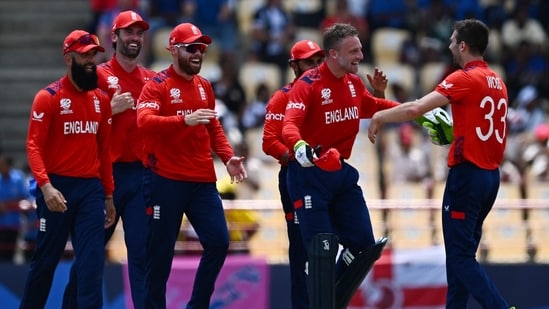 England's Mark Wood (R) celebrates with England's captain Jos Buttler and teammates after running out South Africa's Heinrich Klaasen during the ICC men's Twenty20 World Cup 2024 Super Eight cricket match between England and South Africa at Daren Sammy National Cricket Stadium in Gros Islet, Saint Lucia.(AFP)