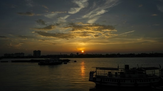 Kolkata: The setting Sun on an evening, seen from the bank of the River Ganga, in Kolkata, Sunday, June 23, 2024. (PTI Photo/Swapan Mahapatra)(PTI06_23_2024_000213B)(PTI)