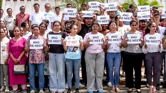 Students protest against NEET-UG retest in Rajkot on Sunday. (ANI)