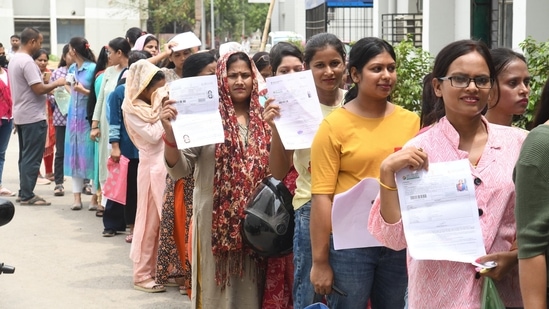 Patna, Bihar, India -June .18, 2024: Aspirants standing in queue for entering an examination centre to appear in the UGC NET exams at A.N. College in Patna, Bihar, India, Tuesday,18, 2024.(Photo by Santosh Kumar/ Hindustan Times)