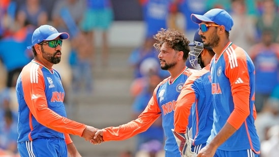 India's Rohit Sharma (c) and Kuldeep Yadav celebrate the dismissal of Australia's Glenn Maxwell (ANI)