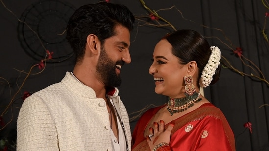 Sonakshi Sinha and Zaheer Iqbal are married! On Sunday, Sonakshi made her first appearance post-wedding at their reception at Bastian in Mumbai in a red saree. Zaheer chose a white ethnic look. (AFP)