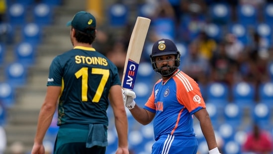 India's captain Rohit Sharma celebrates after scoring 50 runs against Australia (PTI)