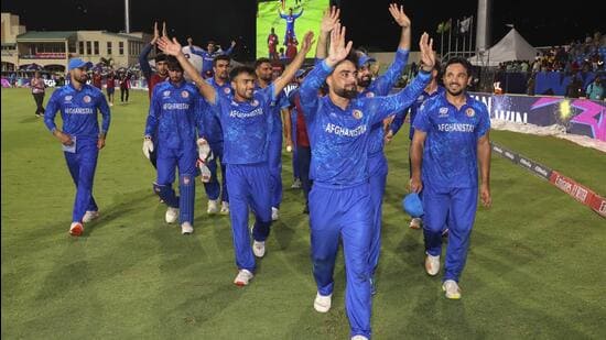 **EDS: IMAGE VIA @ICC** Kingstown: Afghanistan's captain Rashid Khan with teammates acknowledges fans after Afghanistan won the ICC Men's T20 World Cup cricket match against Bangladesh, at Arnos Vale Ground, Kingstown, Saint Vincent and the Grenadines, Monday, June 24, 2024. (PTI Photo)(PTI06_25_2024_000080B) (PTI)