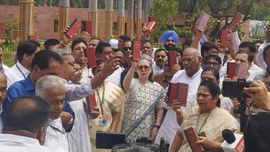 Congress leader Sonia Gandhi and other INDIA bloc leaders show copies of the Constitution of India (PTI)