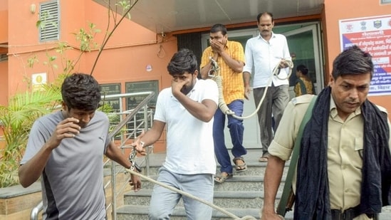 Economic Offences Unit officials leave with the accused arrested in the NEET paper leak case, in Patna, on Sunday. (PTI)(PTI file)