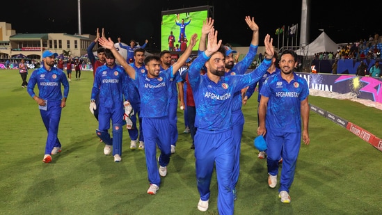 Afghanistan's captain Rashid Khan, with teammates, acknowledges fans after advancing to the ICC Men's T20 World Cup semis by beating Bangladesh(PTI)