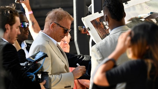 US actor Kevin Costner signs for his fans as he attends the US premiere of "Horizon: An American Saga Chapter 1" at the Regency Village theatre in Westwood, California, June 24, 2024. (Photo by VALERIE MACON / AFP)(AFP)