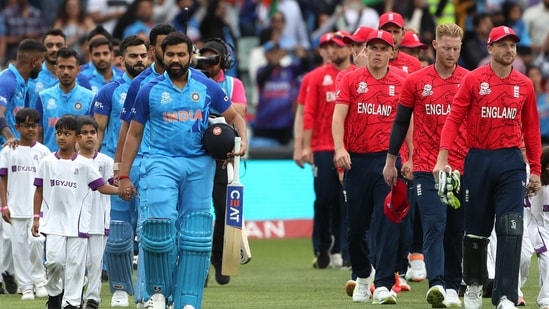 India's Captain Rohit Sharma (L) and England's Captain Jos Buttler (R) escort their respective teams in T20 World Cup semi-final(AFP)