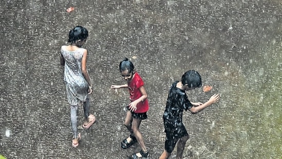 Mumbai, India. June 21, 2024: Children are playing during rain in the Sion area of Mumbai on Friday. June 21, 2024. (Photo by Raju Shinde/HT Photo)