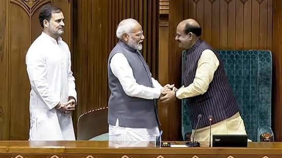 Prime Minister Narendra Modi and Leader of the Opposition Rahul Gandhi with newly elected Lok Sabha speaker Om Birla, at Parliament House in New Delhi on Wednesday. (ANI)