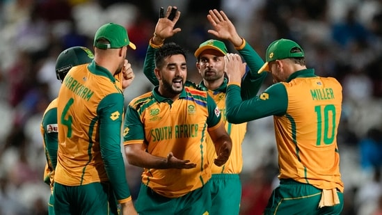 South Africa's Tabraiz Shamsi, centre, is congratulated by teammates after dismissing Afghanistan's Noor Ahmad(PTI)