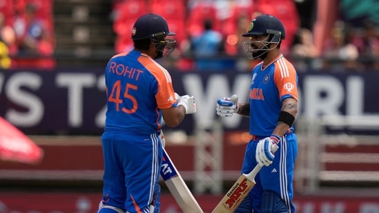 India's captain Rohit Sharma, left, and Virat Kohli celebrate scoring runs during the ICC Men's T20 World Cup second semifinal cricket match between England and India at the Guyana National Stadium in Providence, Guyana(PTI)