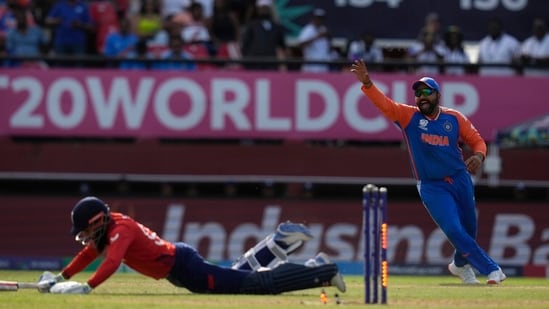 India's captain Rohit Sharma, right, celebrates the run-out of England's Adil Rashid(PTI)