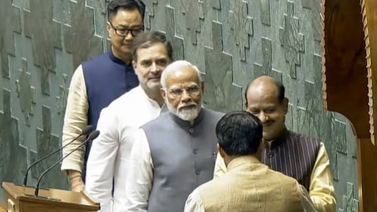 Prime Minister Narendra Modi, Leader of the Opposition Rahul Gandhi and Union Minister for Parliamentary Affairs Kiren Rijiju escort Om Birla to the chair after the latter was elected as the Speaker of the House during the first session of the 18th Lok Sabha,(PTI)