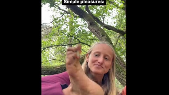 Snapshot of the woman picking strawberry from her feet. (Instagram)