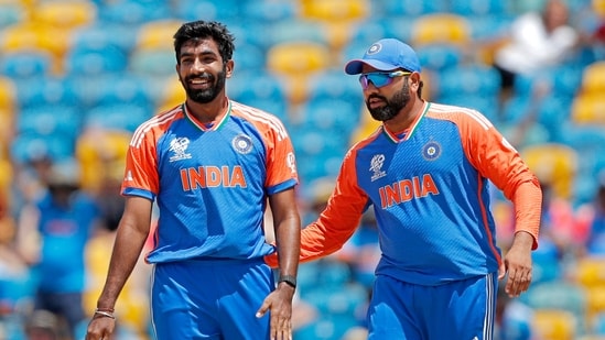 India's Jasprit Bumrah and Rohit Sharma (c) celebrate a wicket.(Surjeet Yadav)