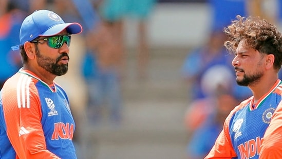 India's Rohit Sharma (c) and Kuldeep Yadav celebrate the dismissal of Australia's Glenn Maxwell during their Super 8 Group 1 match in the ICC Mens T20 World Cup 2024 (Surjeet Yadav)