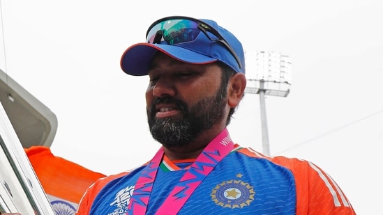 India's captain Rohit Sharma poses for a picture with the trophy after Team India wins the ICC Mens T20 World Cup 2024 (Surjeet Yadav)