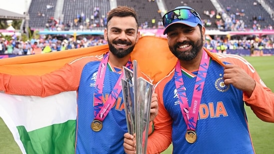 Barbados, Jun 30 (ANI): India's captain Rohit Sharma and Virat Kohli pose for a picture with the trophy after Team India wins the ICC Mens T20 World Cup 2024 final match against South Africa, at Kensington Oval in Barbados on Saturday. (ANI Photo)(ICC - X )