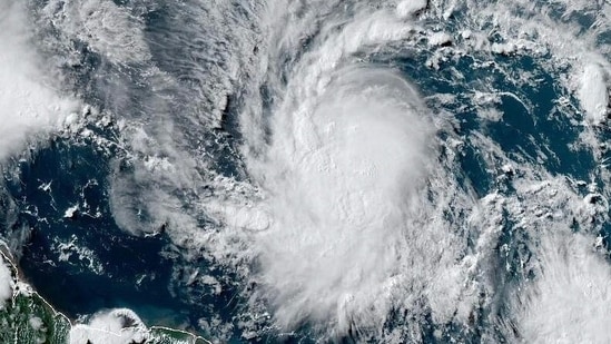 This National Oceanic and Atmospheric Administration (NOAA)/GOES satellite handout image shows Tropical Storm Beryl at 19:30UTC on June 29, 2024. Much of the southeast Caribbean went on alert Saturday as Tropical Storm Beryl was set to undergo rapid strengthening, becoming a "dangerous" major hurricane before it crosses the Windward Islands sometimes on June 30, forecasters said.(AFP)