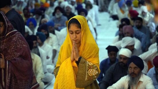 A woman pays obeisance at a gurudwara. (AP)