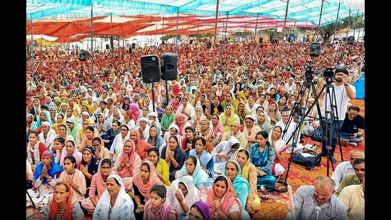 Devotees at the religious gathering where a stampede broke out, in Hathras district on Tuesday. (PTI)