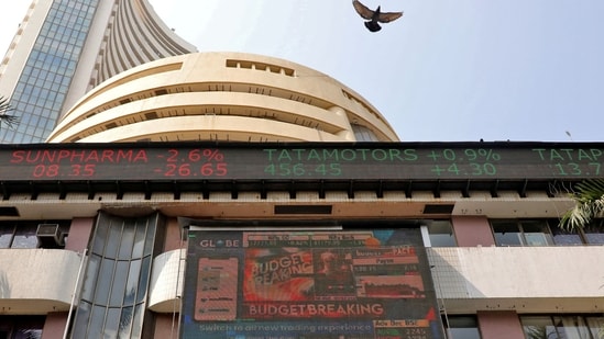 Stock market today: A bird flies past a screen displaying the Sensex results on the facade of the Bombay Stock Exchange (BSE) building in Mumbai.(Reuters)