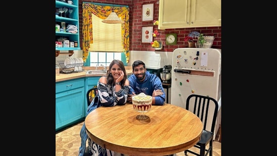 The image shows Sanjana Ganesan and Jasprit Bumrah hanging out in Monica's kitchen from the famous TV show Friends. (Instagram/@sanjanaganesan)