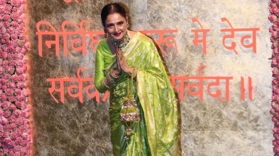 For the Ganesh Chaturthi celebrations, Rekha wore a green and golden saree and a matching blouse. She wore traditional jewellery and carried a potli with her. The veteran actor also posed and smiled for the paparazzi.