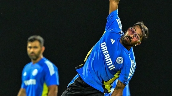 India's Hardik Pandya (R) delivers the ball during a practice session ahead of their first Twenty20 cricket match against Sri Lanka