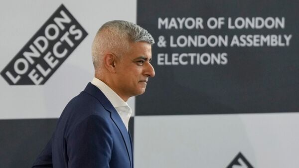 Sadiq Khan walks on to the stage as he is re-elected for a record third time as Mayor of London