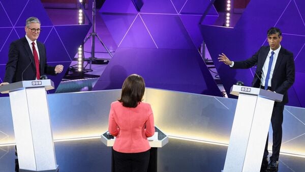 Labour Party leader Keir Starmer (L) and Britain's Prime Minister and Conservative Party leader Rishi Sunak attend a live TV debate, hosted by The BBC, in Nottingham, on June 26, 2024, in the build-up to the UK general election on July 4. (Photo by Phil Noble / POOL / AFP)