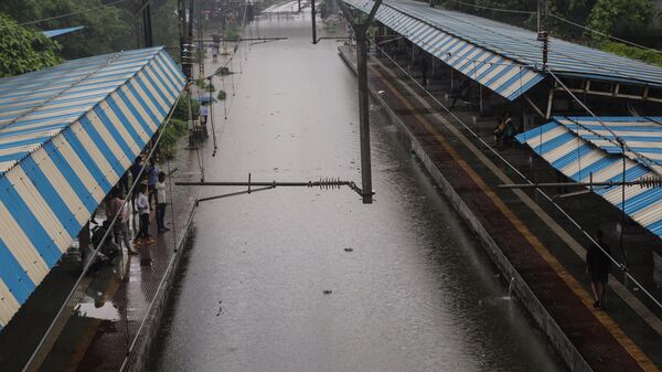 Mumbai, Jul 08 (ANI): Chunabhatti Railway Station gets waterlogged amid heavy rain, in Mumbai on Monday. (ANI Photo) 