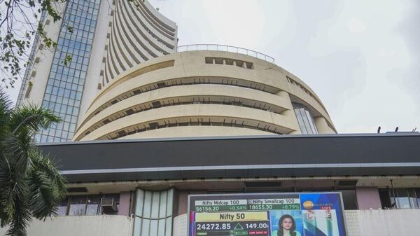 Stock prices displayed on a digital screen at the facade of the Bombay Stock Exchange building, in Mumbai.