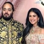 Reliance Industries Chairman Mukesh Ambani's son Anant Ambani and his fiancé Radhika Merchant pose for a photo during the sangeet ceremony ahead of their wedding, at Jio World Centre in Mumbai on Friday. (ANI )
