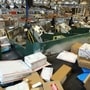 Workers sorted packages at a U.S. Postal Service center in San Francisco. Photo: Justin Sullivan/Getty Images