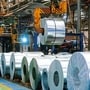 A coil of galvanized steel is transported by a coil grab crane above other coils at the manufacturing facility of Uttam Galva Steels Ltd., the Indian unit of ArcelorMittal, in Khopoli, Maharashtra, India, on Friday, June 13, 2014. ArcelorMittal, the world’s largest steelmaker and one of the few foreign steel mills with investments in China, welcomed the potential removal of a near 10-year block on overseas takeovers in China’s steel industry. Photographer: Vivek Prakash/Bloomberg