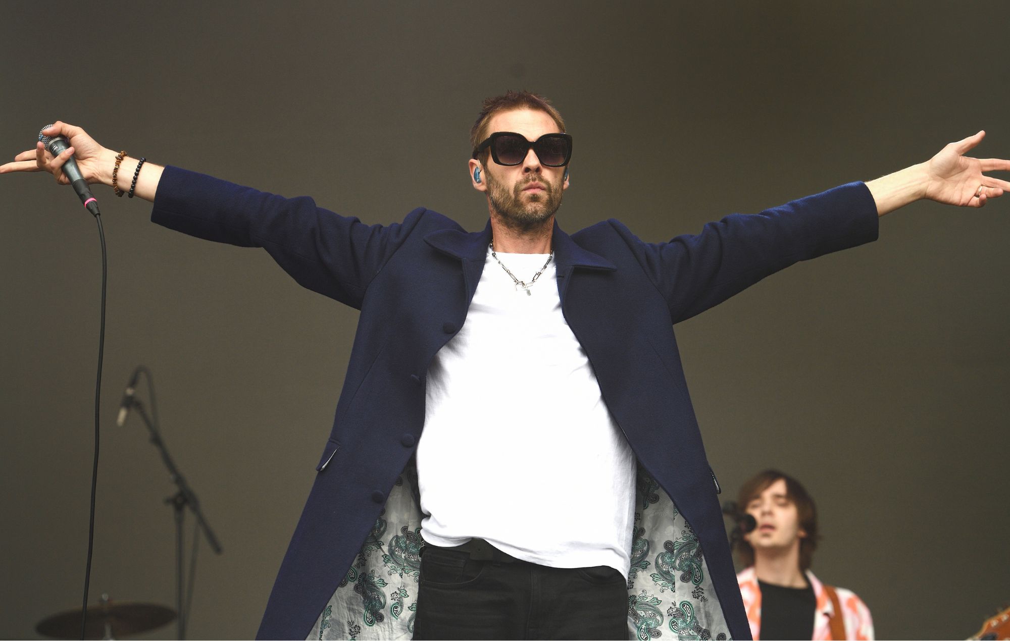 Tom Meighan performs on stage at Audley End House on August 05, 2023 in Saffron Walden, England.