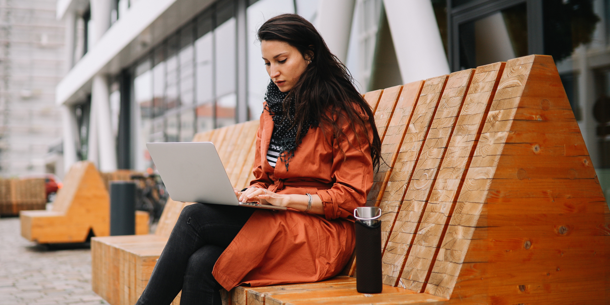 woman connected to wireless network in city